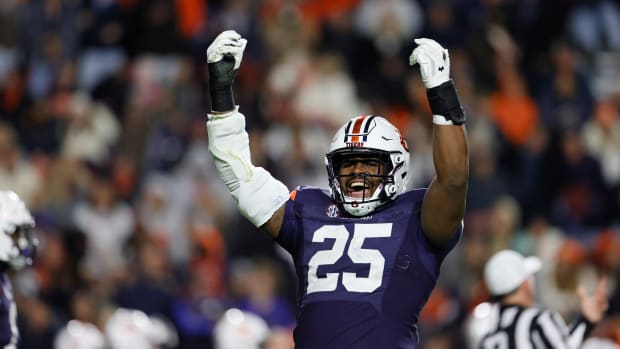 Nov 12, 2022; Auburn, Alabama, USA; Auburn Tigers defensive end Colby Wooden (25) tries to get the fans excited starting the fourth quarter against the Texas A&M Aggies at Jordan-Hare Stadium. Mandatory Credit: John Reed-USA TODAY Sports